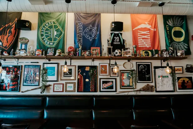 The Sports Bra exhibits five television screens mounted on walls, framed jerseys, and souvenirs from a clutch of women's teams.